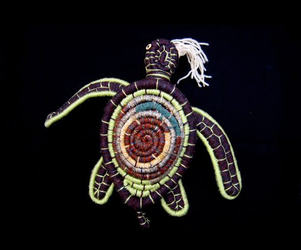 "Coiled Turtle Eating Jelly Fish"