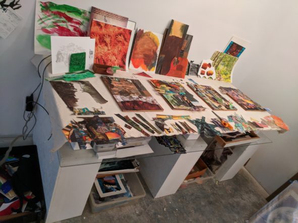 collage artists work table in use with canvas topper